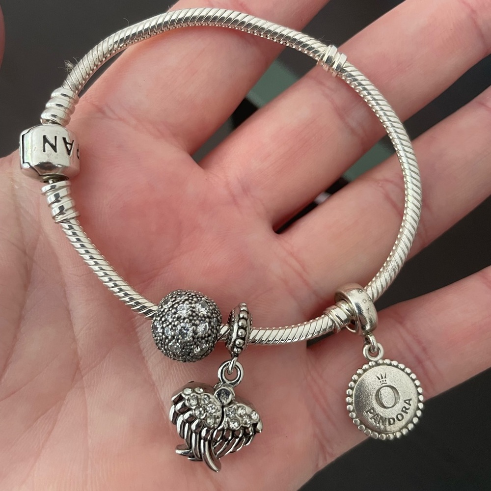 Pandora snake chain bracelet with 3 charms. New.